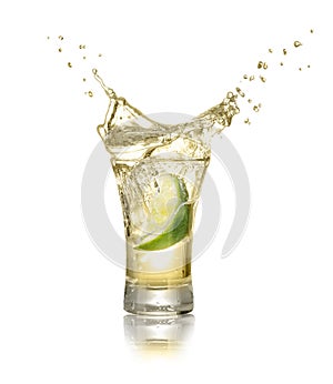 Shot of gold tequila with splash