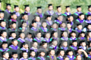 Shot of graduation caps during commencement. The image was blurred for use as a background.