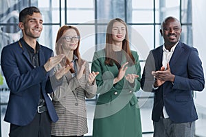 Shot of a group of businesspeople applauding during a seminar in the conference room.