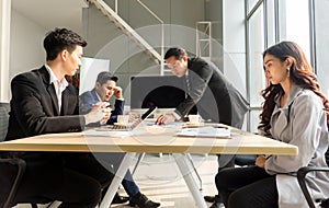 Shot of a group of businesspeople having a discussion in seminar at office