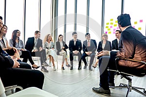 Shot of a group of businesspeople having a discussion in seminar at office