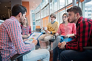 Shot of a group of young business professionals having a meeting.