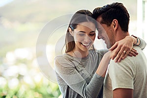 Falling deeper in love every moment theyre together. Shot of a happy young couple in a loving embrace.