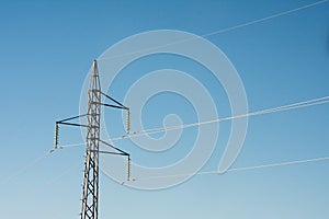 Shot of high tension electric pole carrying high voltage electricity