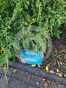 shot of an indicative sign fallen to the ground, common waste