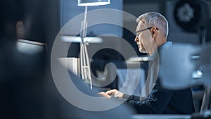 Shot of Industrial Engineer Working in Research Laboratory / Development Center, Using Computer. H