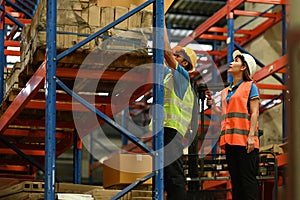 Shot of industrial workers checking inventory and quantity of storage product on shelf in a large warehouse