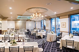 Shot of interior design of the bright and decorated dining area of the wedding hall