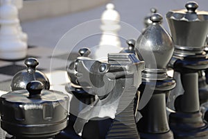 A shot of a large black and white chess set on the sidewalk at Atlantic Station photo