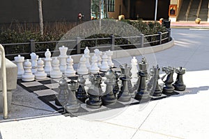 A shot of a large black and white chess set on the sidewalk at Atlantic Station