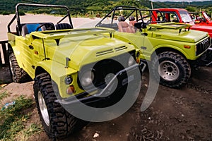 A shot of a line of the tourist jeeps at the beach