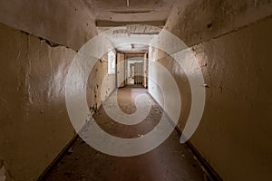 Shot of a long narrow corridor in an old prison