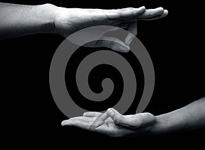 Shot of a male hand demonstrating Jnana Mudra or Wisdom mudra isolated on black background