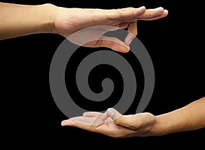 Shot of a male hand demonstrating Jnana Mudra or Wisdom mudra isolated on black background