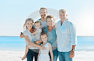 Every day with them is magical. Shot of a multi-generational family spending the day at the beach. photo