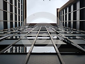 Shot of a multistory building from its ground floor