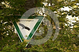 Shot of a nature revere sign on a tree
