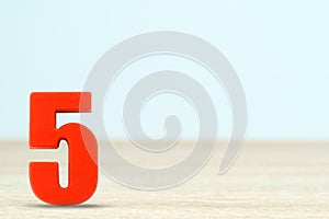 Shot of a number five made of red plastic
