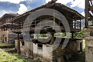 Shot of old houses made of stone and wo?d under the cloudy sky