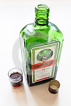 Shot and open bottle of Jagermeister digestif