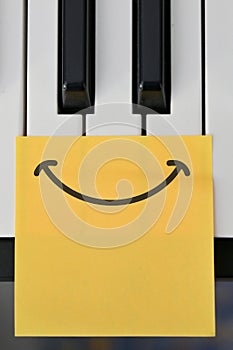 Shot Of Piano Keyboard and Draw Happy Smile Note