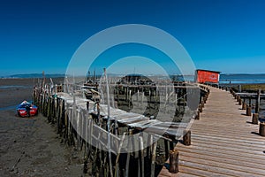 Shot of the pier during low tide afternoon in Cais PalafÃ­tico da Carrasqueira, Portugal
