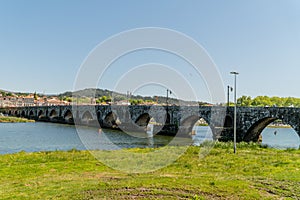 A shot of Ponte de Lima Bridge on sunny Day, Portugal photo