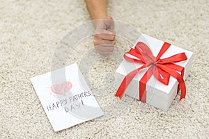 Shot of present box and postcard for happy father`s day.