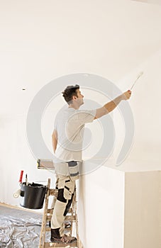 Shot of professional contractor painter refurbishing the apartment