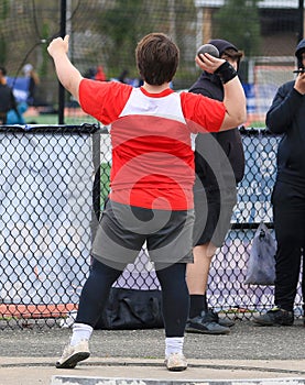 Shot put thrower ready to throw in the circle