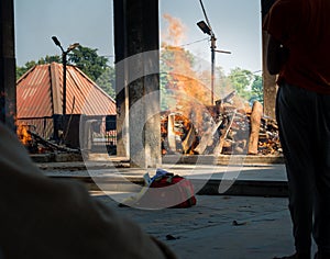 A shot of pyre burning at a cremation along side river in Haridwar, India
