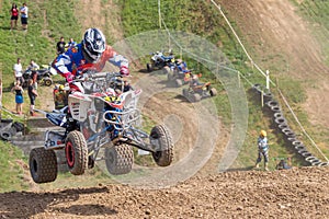 Shot of quad rider jumping in the race