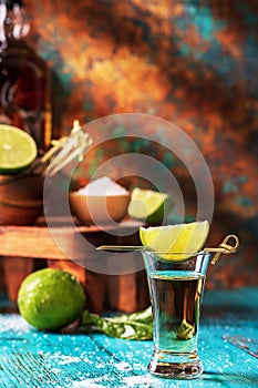 Shot of Reposada Tequila on Worn Aqua Table