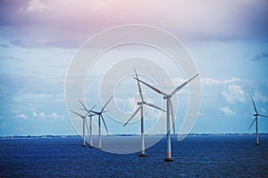 Shot of row of floating wind turbines