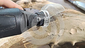 Shot of a sanding process making wood smoother with a special electric tool