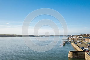 Shot of a sea and a red channel marker taken from distance