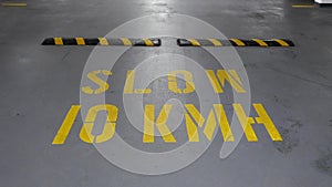Shot of a slow 10km sign on floor