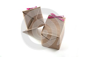 Shot of small gift box with pink ribbon