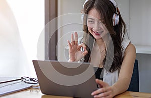 Shot of smiling businesswoman looking at camera webcam make conference business group call, online training concept