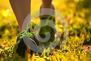 Shot of sports shoes on background of grass.