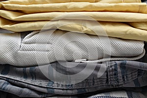 shot of Stack of folded cotton clothes in horizontal frame