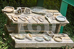 Shot of stone and wooden items on display on a table in Swaziland
