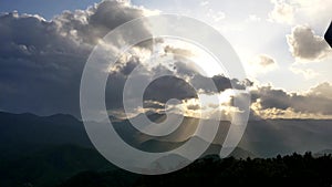 shot of the sun ray breaking through cloud from the top of mountain moiwa, hokkaido, japan