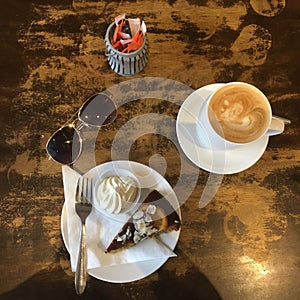 Before Shot Top View of Orange Poppyseed Cake and Coffee in cafe