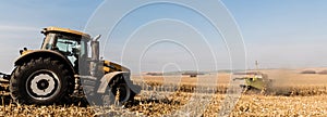 Shot of tractors on golden field