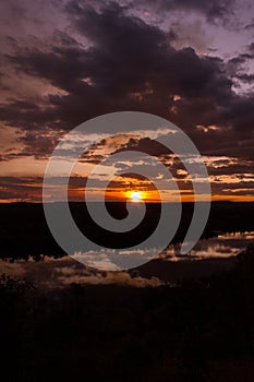 Shot through tress of a beautiful sunset in the australian outback with 1 lakes, Nitmiluk National Park, Australia