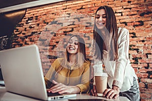 Shot of two businesswoman working together in office