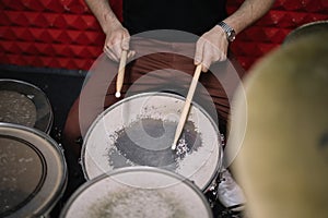 Shot of an unrecognizable man playing the drums