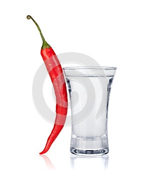 Shot of vodka and red hot chili pepper