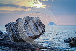 Wanli Fist Stone at Sunrise - Famous natural spot of Wanli District, New Taipei, Taiwan. photo